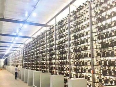 Vast cryptocurrency mining farm humming with rows of Bitcoin mining rigs